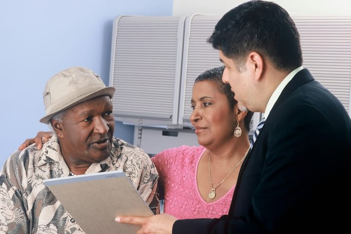 Picture of a senior couple talking to an insurance agent 